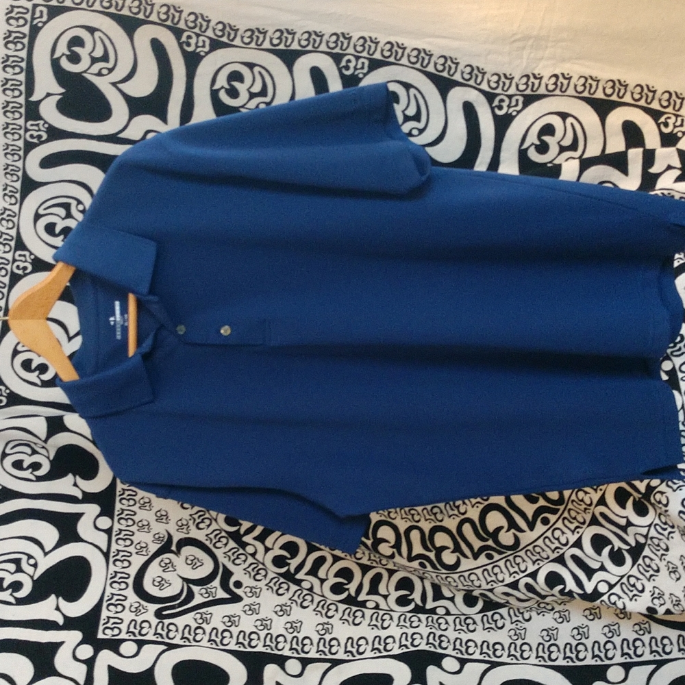 Mens blue short sleeve polo golf shirt by Grand Slam Golf. Size XL.